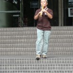 Alcvin playing shakuhachi in front of the Symphony Hall in Osaka